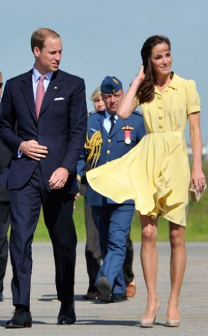 Kate in buttercup-yellow dress with a pleated skirt and blouson top by British designer Jenny Packham.jpg